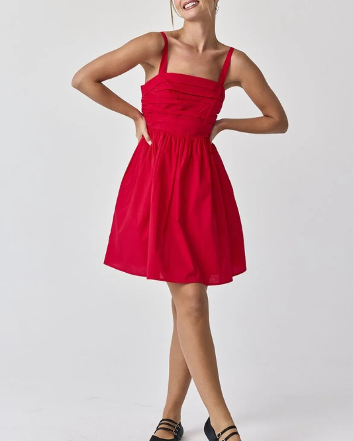 Red ruched empire waist mini dress with spaghetti straps